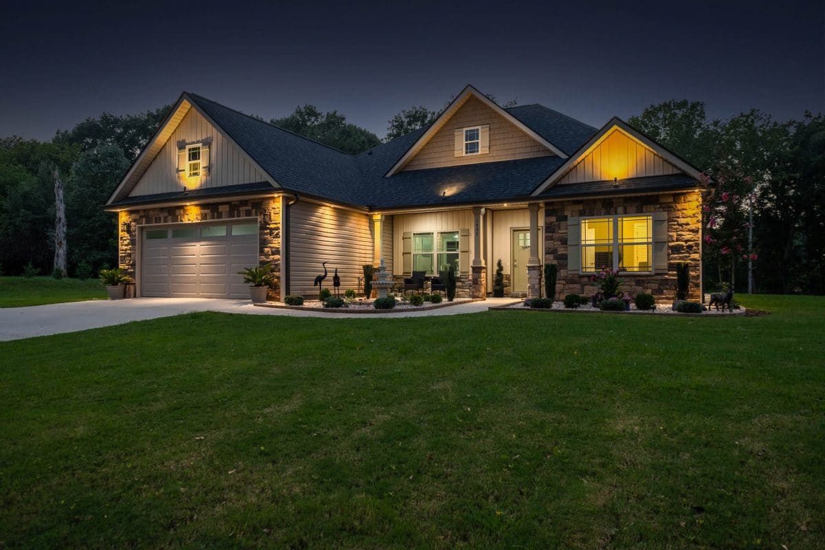 A house with lights on the outside of it